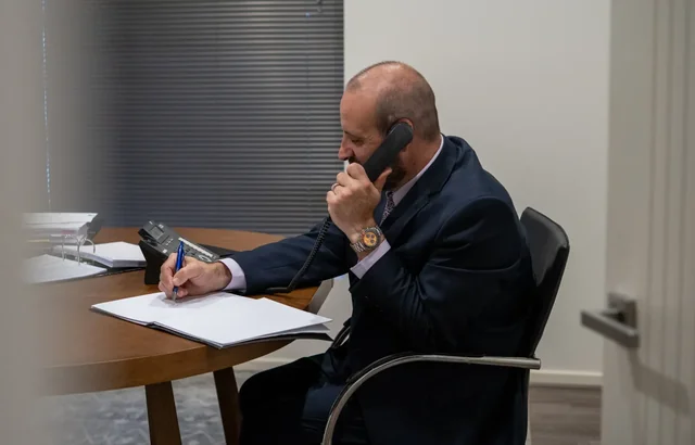 Phil Testa calling on phone.